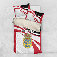 Denmark flag bedding set shown from above: duvet and two pillows with crest and 'YOUR TEXT'.