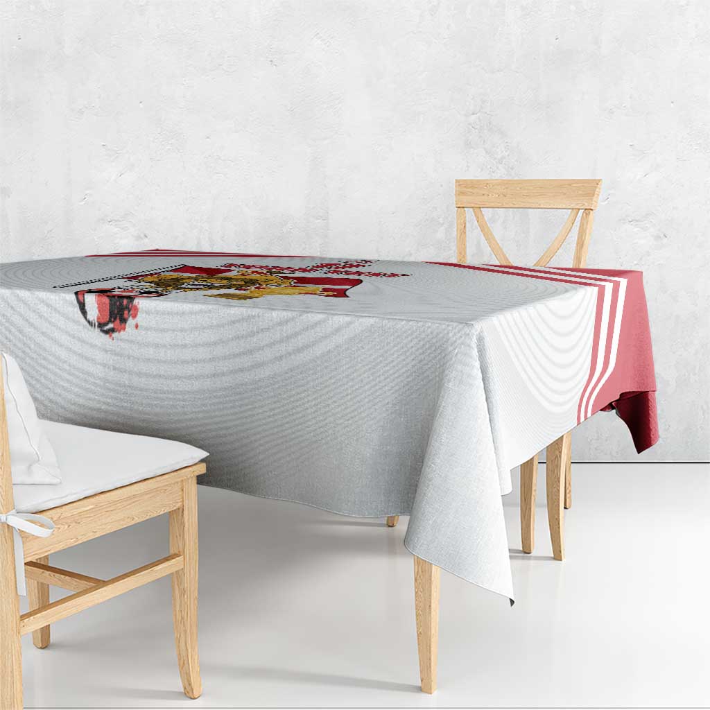 White tablecloth with red stripe border and football logo graphic across tabletop