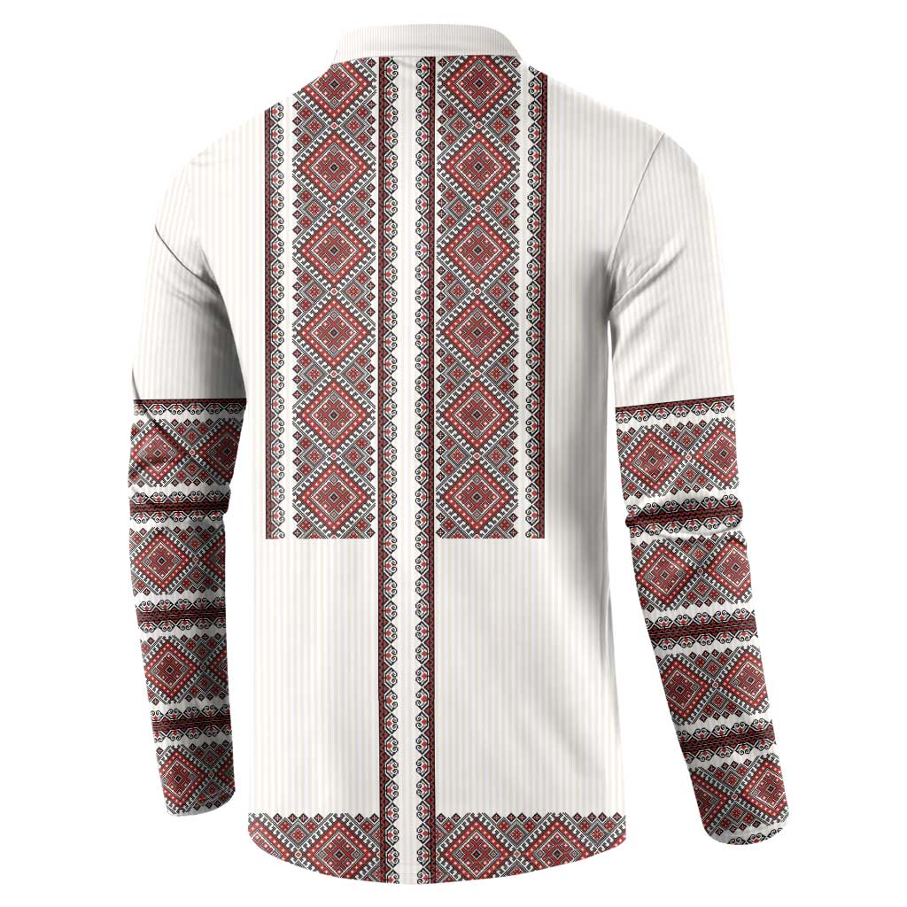 White button-front sweatshirt with red-and-black geometric embroidery on back and sleeves
