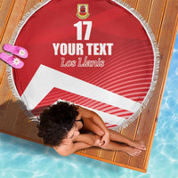 Red circular beach blanket with fringe, crest and “YOUR TEXT”, “Los Llanis”, number 17