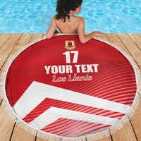 Red circular beach blanket with fringe, crest at top, “YOUR TEXT”, “Los Llanis” and 17