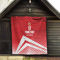 Red quilt blanket with diamond quilting, number 17 and crest, with white diagonal stripe design