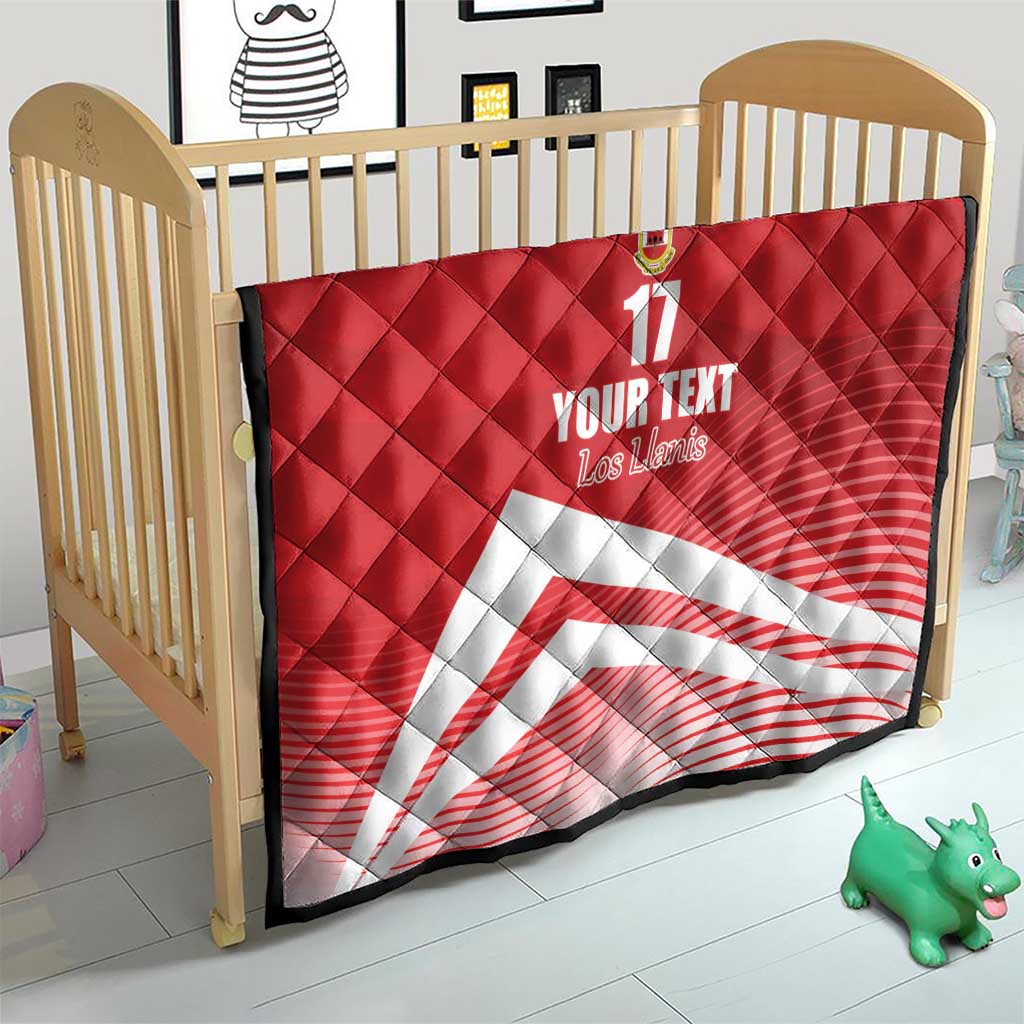 Red quilt blanket with diamond quilting, crest and number 17, with white diagonal stripe for crib
