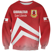 Red crewneck sweatshirt with Gibraltar crest and Los Llanis graphic, long sleeves