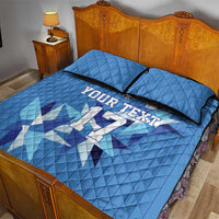 Blue quilt bed set with custom jersey text and geometric football pattern, two pillows