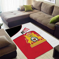 Red, white, and dark black stripe 'AYITI' area rug with lion crest