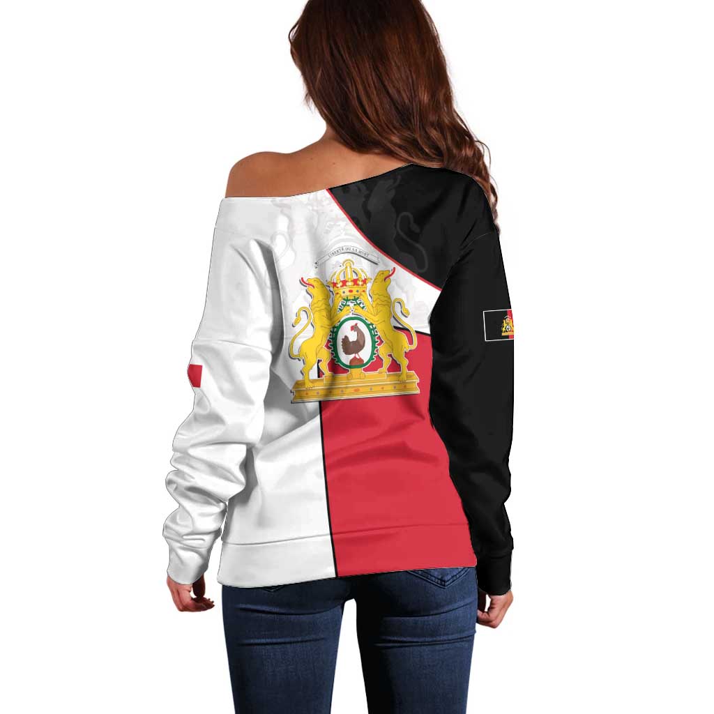 Women’s off-shoulder sweater back view, black and white panels with red center crest