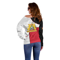 Women’s off-shoulder sweater back view, black and white with red center panel and crest
