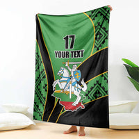 Green and black rugby-style blanket draped vertically showing '17 YOUR TEXT' rider crest