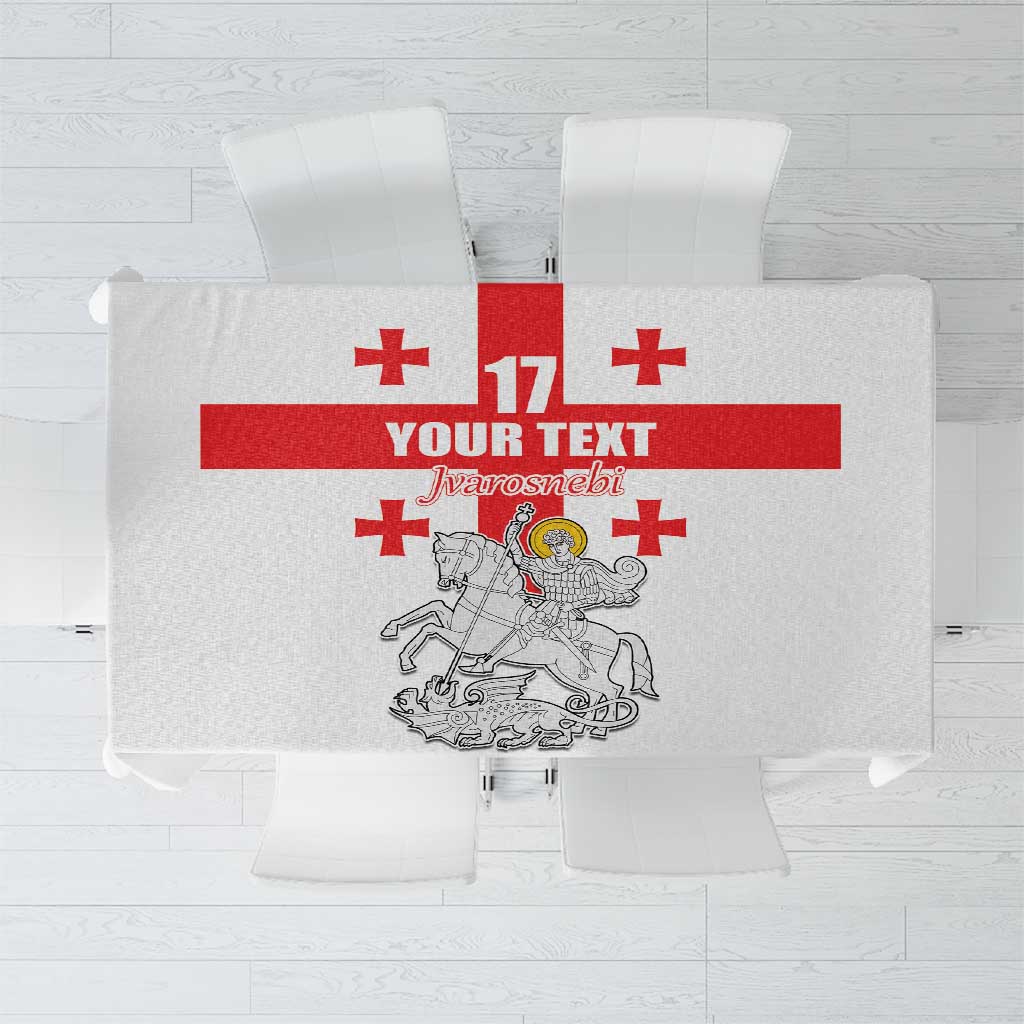 White tablecloth with centered red crest and 17 graphic