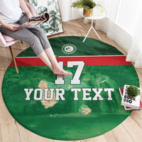 Green round football rug on floor; shows '17' and 'YOUR TEXT' design