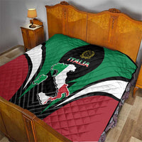 Quilt blanket on bed with green top, red bottom, black Italia crest and Italy map
