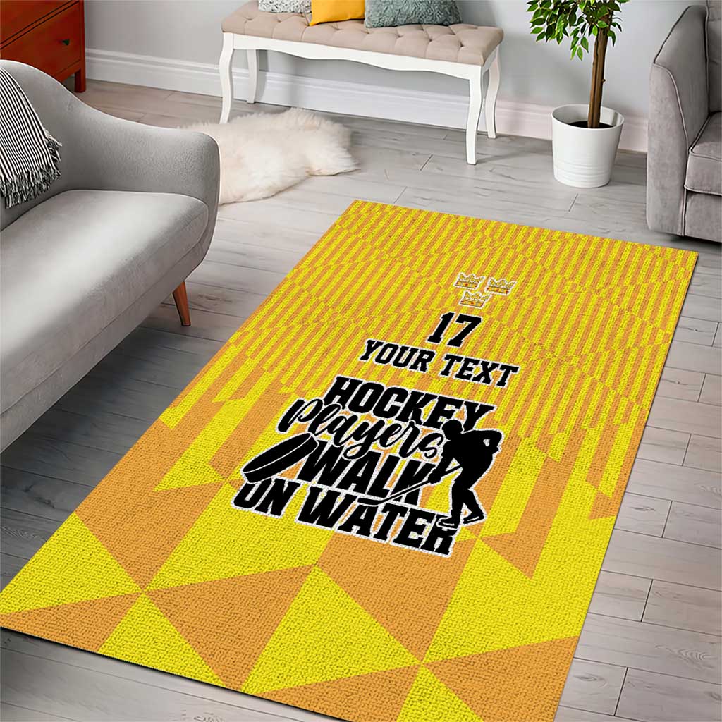 Yellow area rug with geometric blocks and hockey player graphic, '17' and 'Your Text'