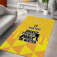 Yellow area rug with geometric blocks and hockey player graphic, '17' and 'Your Text'