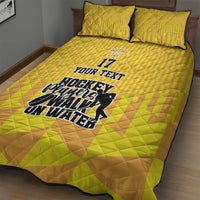 Yellow hockey quilt bed set with two pillows; large hockey players graphic and No.17