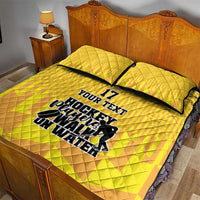 Yellow hockey quilt bed set with two pillows; 'YOUR TEXT' hockey graphic across quilt, No.17