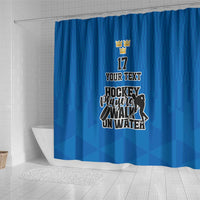 Blue hockey-themed shower curtain with custom text and player logo centered