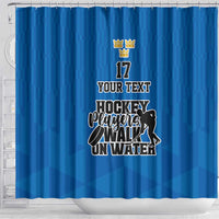Blue hockey shower curtain with custom text, crown graphic, and player silhouette