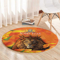 Round orange carpet with lion portrait, crest, tulip graphics and custom text