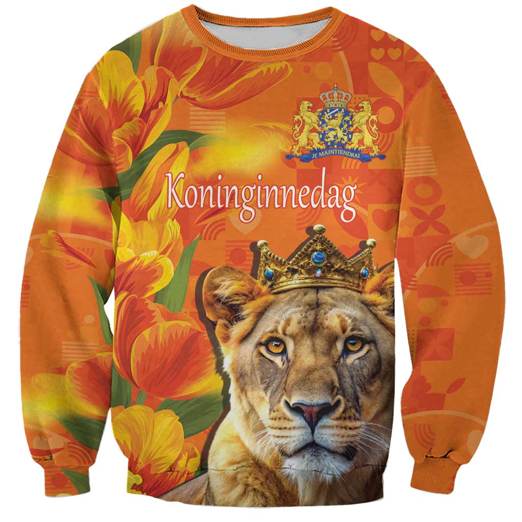 Orange crewneck sweatshirt with lion and royal crown graphic, floral tulip pattern