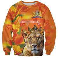 Orange crewneck sweatshirt with lion and royal crown graphic, floral tulip pattern