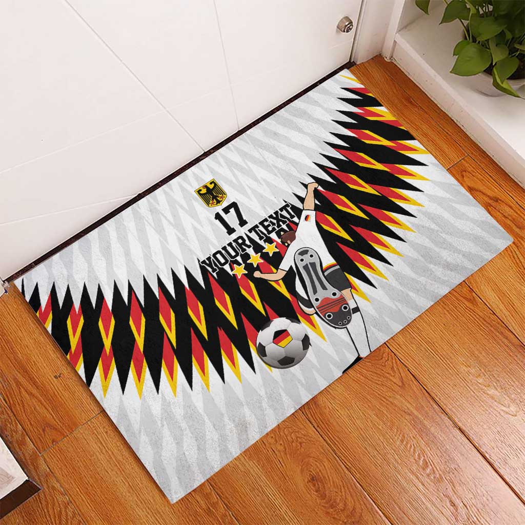 White football doormat with zigzag banner design, soccer ball graphic, and player figure, 17