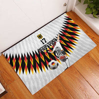 White football doormat with zigzag banner design, soccer ball graphic, and player figure, 17