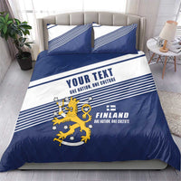 Blue and white duvet cover with Finland lion crest, striped bands, and two pillowcases