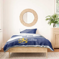 Blue and white duvet cover with Finland lion crest and striped bands, one pillow