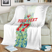 Custom football blanket, white with number 17 graphic and red “YOUR TEXT”, draped