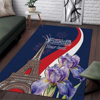 Blue area rug with Eiffel Tower, Bastille Day text, red-white curve, and purple flowers