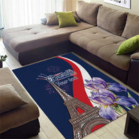 Blue area rug with Eiffel Tower design, red-white curve, and purple flowers