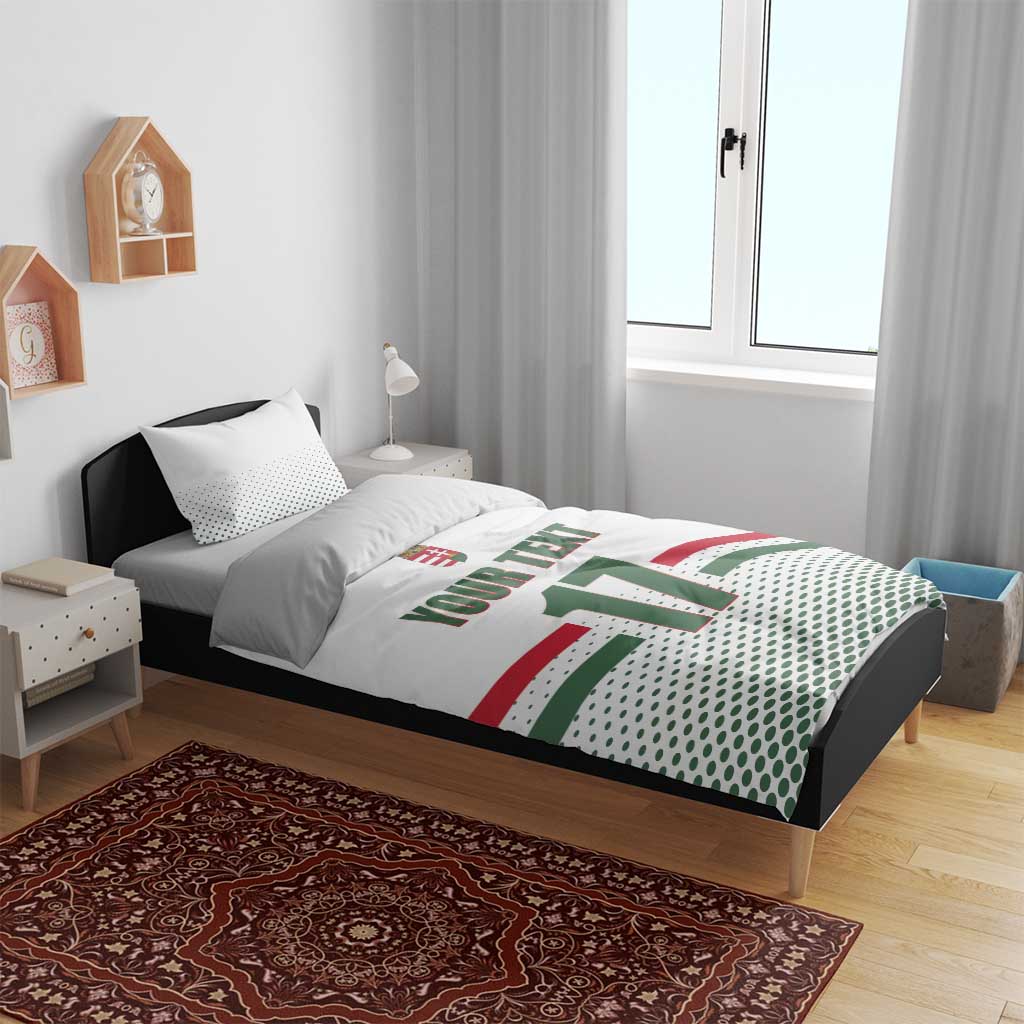 White ice hockey duvet on bed with two pillows; Hungarian “17” and crest graphic