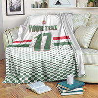 White custom ice hockey blanket draped over couch; Hungary crest, 'YOUR TEXT', number 17