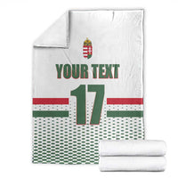 White custom ice hockey blanket with folded stack; Hungary crest, 'YOUR TEXT', number 17