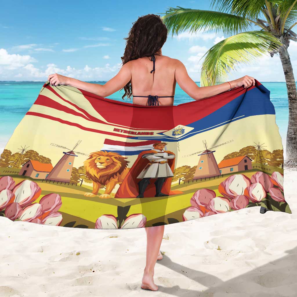 Yellow sarong spread flat: lion, knight, windmills and tulips with red and blue bands