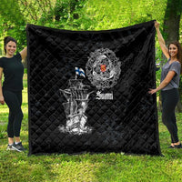 Black quilt with diamond quilting and large white Viking ship design, crest, and “Suomi” text