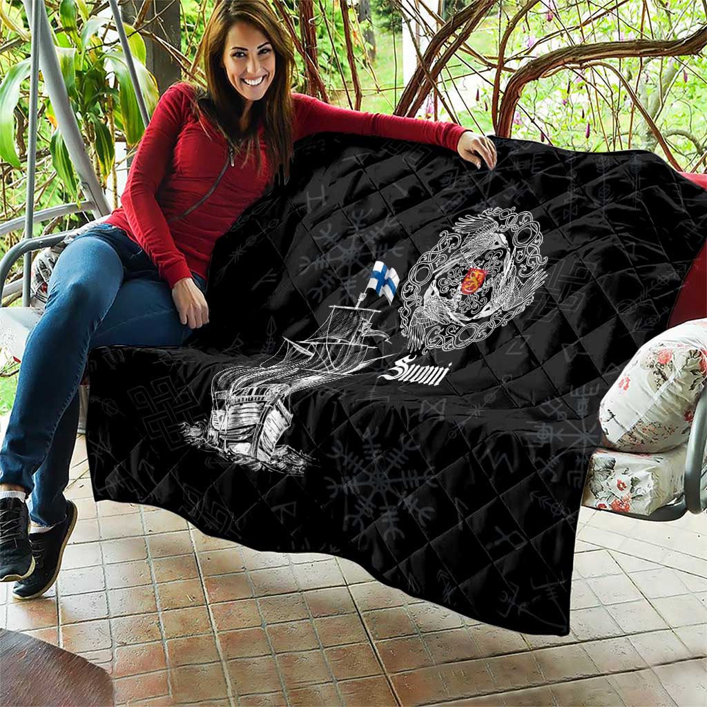 Black quilt with diamond stitching and Viking ship print, crest emblem, and “Suomi” text