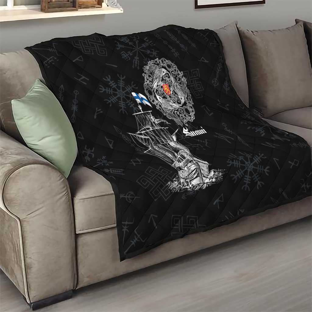 Black quilt with diamond quilting and white Viking ship graphic, crest emblem, and “Suomi” text