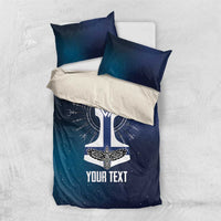 Navy galaxy bedding set with rune sword emblem, two pillows, and 'YOUR TEXT' print