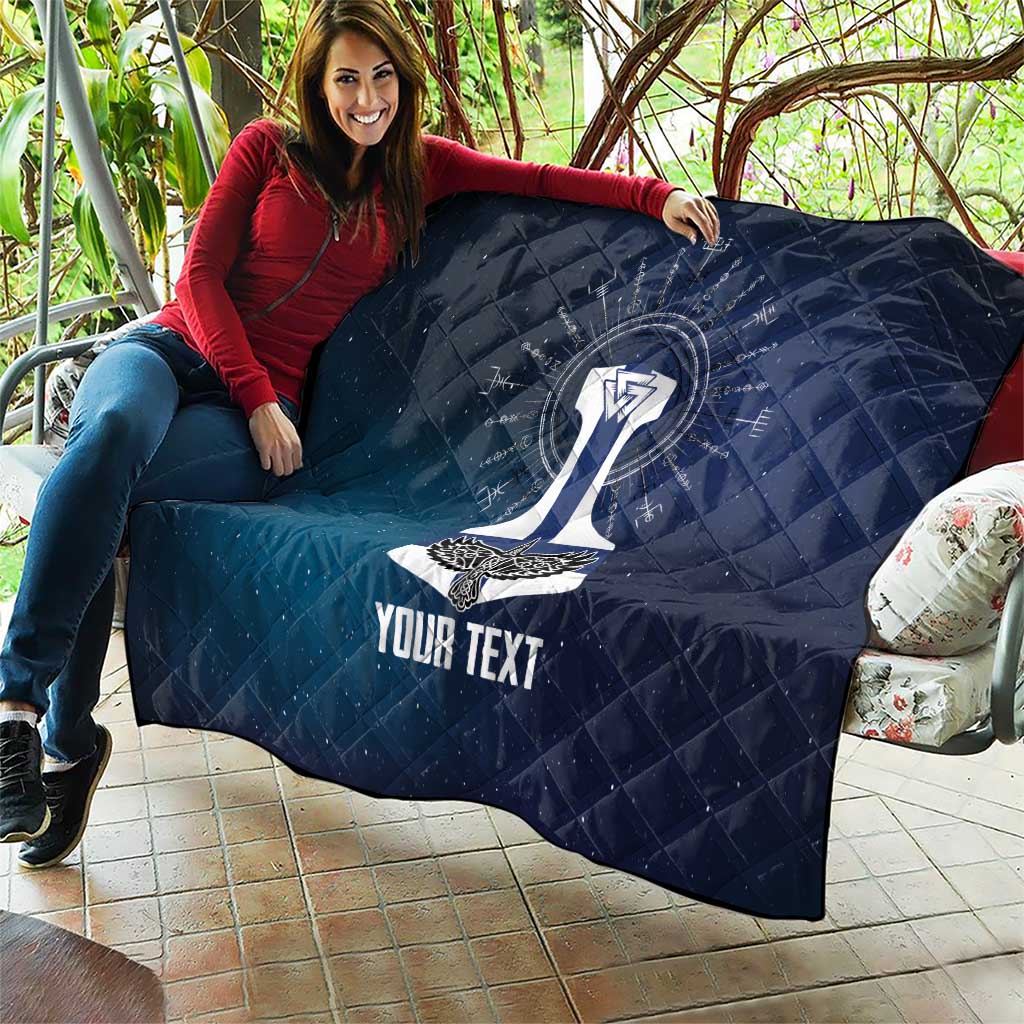 Dark blue quilted blanket with sword graphic and “YOUR TEXT” on outdoor couch