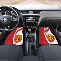 Red car floor mats with white stripe and golden Norway crest emblem, front seats
