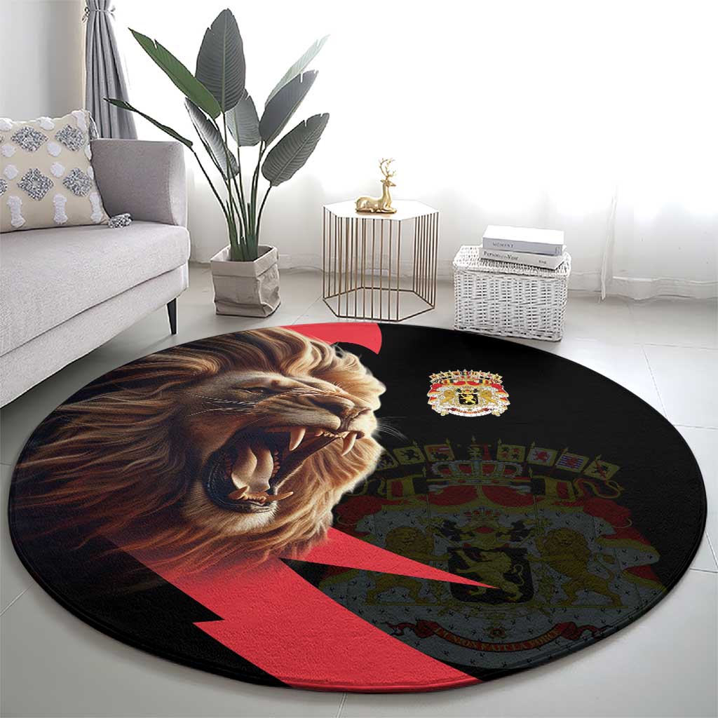 Round black rug with lion head, small crown coat-of-arms crest, and red diagonal stripe