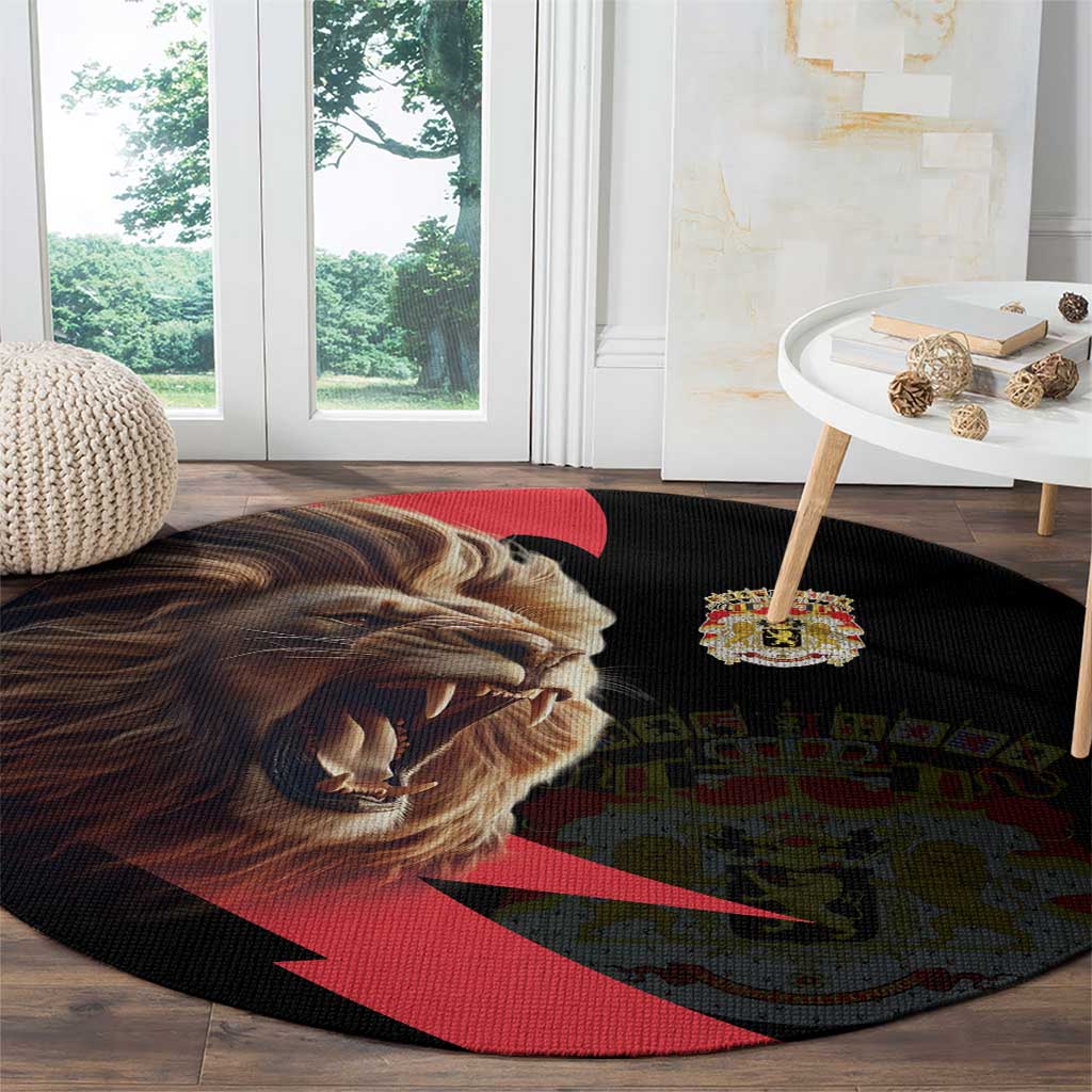 Round black rug with angry lion graphic, crown emblem, and red diagonal stripe