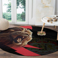 Round black rug with angry lion graphic, crown emblem, and red diagonal stripe