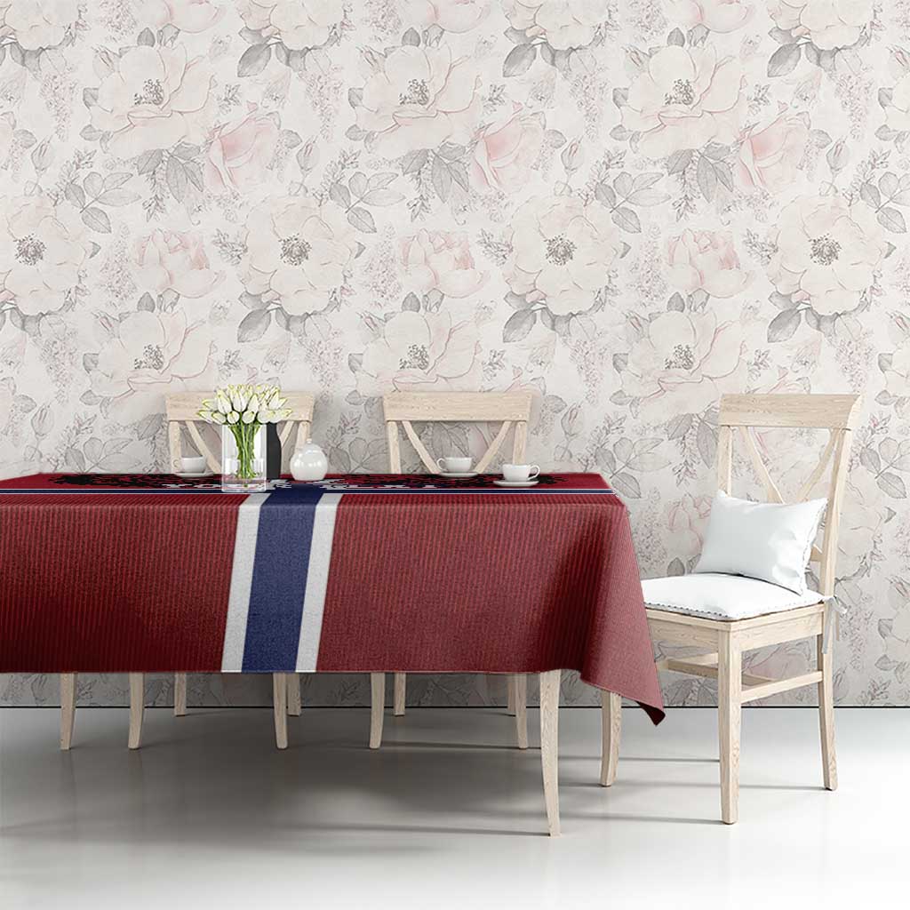 Red football tablecloth with Norway flag cross on dining table with chairs and flowers