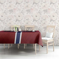 Red football tablecloth with Norway flag cross on dining table with chairs and flowers