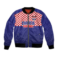 Blue bomber jacket with red-white checker panel, front zipper, ribbed cuffs, Croatia crest