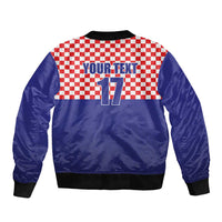 Blue bomber jacket with red-white checker panel, front zipper, ribbed cuffs, YOUR TEXT 17