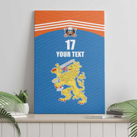 Blue canvas wall art leaning on a shelf; orange top, white stripes, lion sports emblem